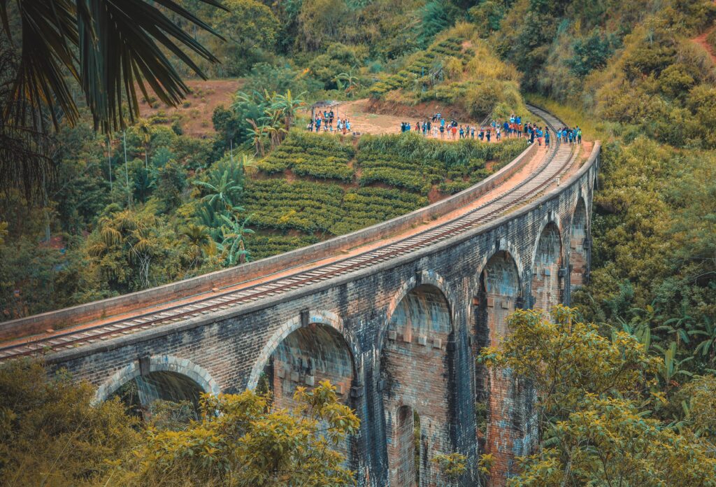 Nine Arch Bridge surrounded by lush green tea plantations in Ella, Sri lanka
