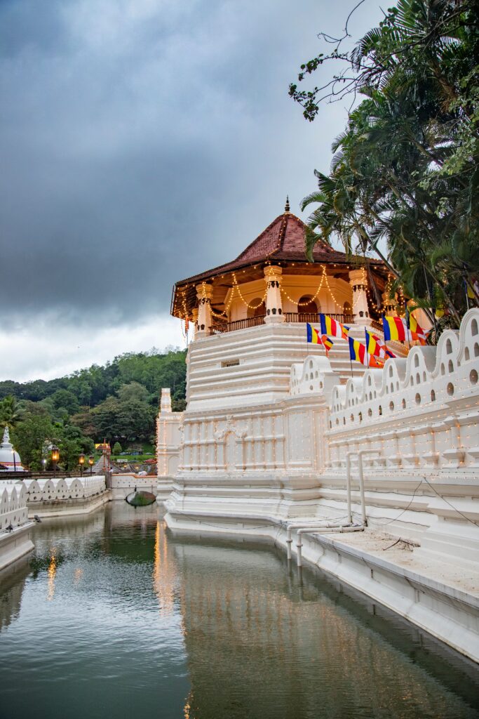 Intricate architecture and golden doors inside the Sacred Temple of the Tooth Relic in Kandy.
