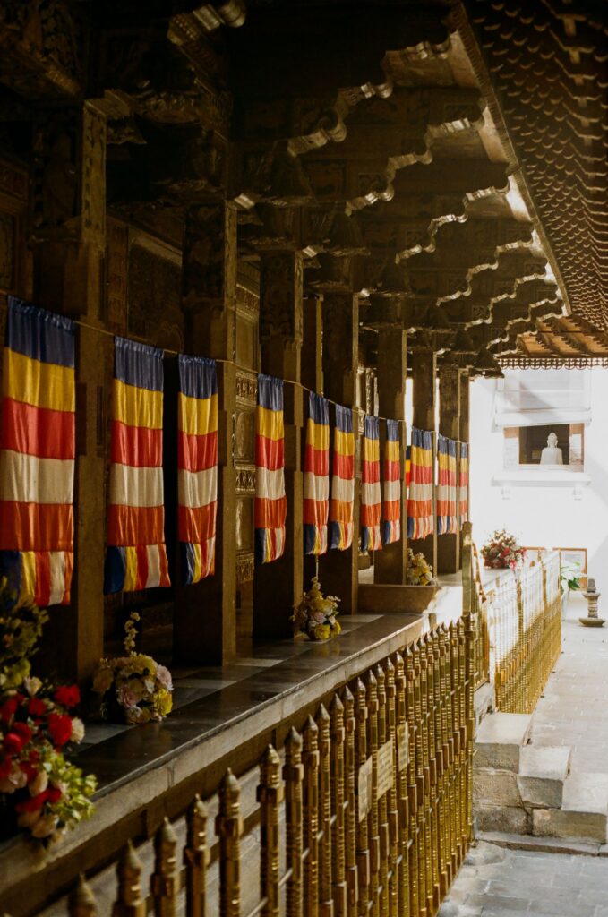 Intricate architecture and golden doors inside the Sacred Temple of the Tooth Relic in Kandy.